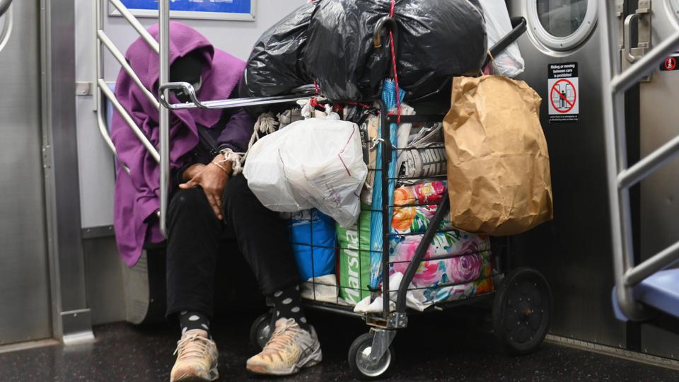 New York's homeless flock to empty subway trains