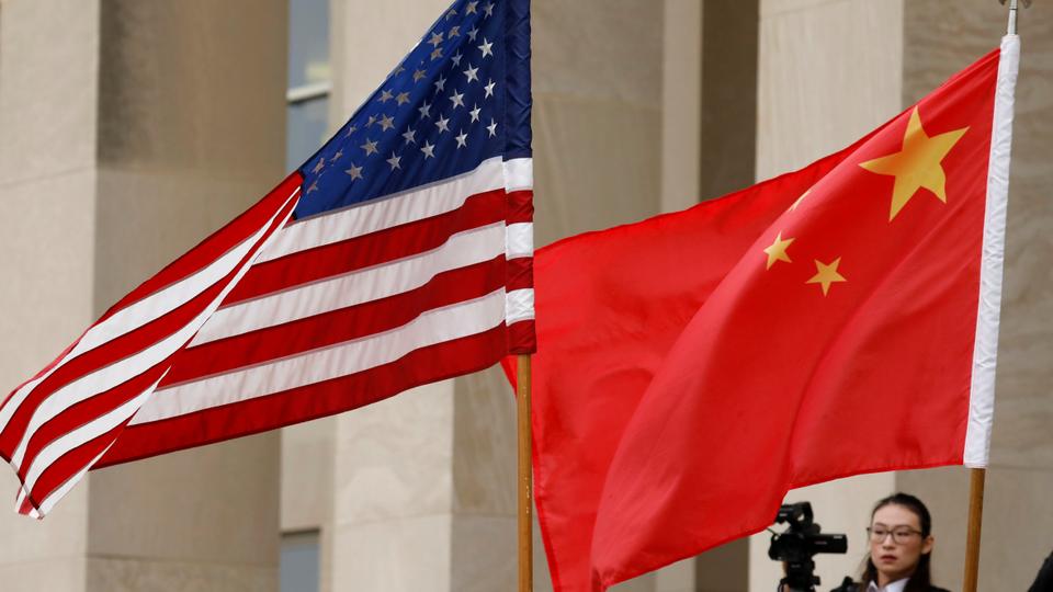 US and Chinese flags are seen in Arlington, Virginia, US, November 9, 2018.