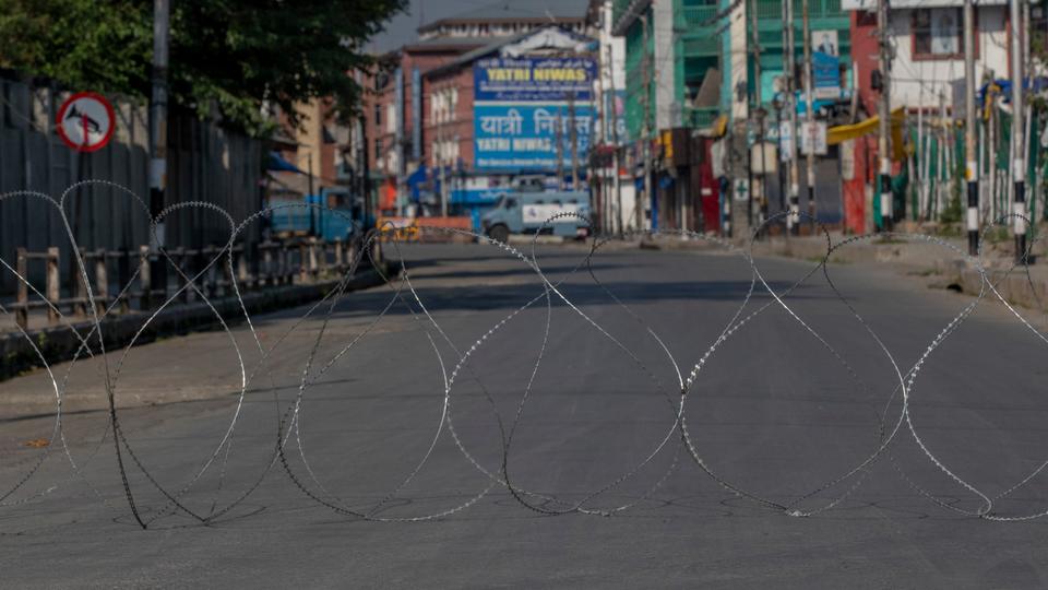 Barbed wire blocks a deserted street on the first anniversary of India’s decision to revoke the disputed region’s semi-autonomy, in Srinagar, Indian-controlled Kashmir. August 5, 2020.