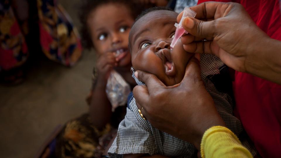 In this April 24, 2013 file photo, a Somali baby receives a polio vaccine at the Medina Maternal Child Health centre in Mogadishu, Somalia.