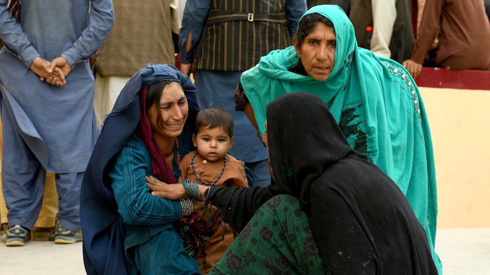 Relatives of the wounded react to news of the blast in Mazar-i-Sharif, Afghanistan on  August 25, 2020.