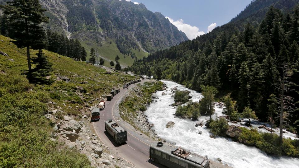 An Indian Army convoy moves along a highway leading to Ladakh at Gagangeer in Kashmir's Ganderbal district on June 18, 2020.