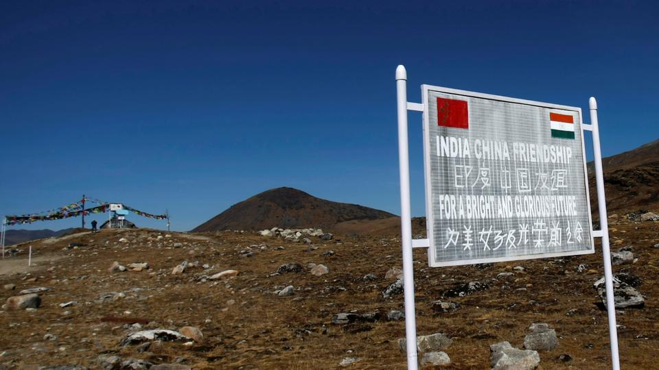 A signboard is seen from the Indian side of the Indo-China border at Bumla, in the northeastern Indian state of Arunachal Pradesh, November 11, 2009.