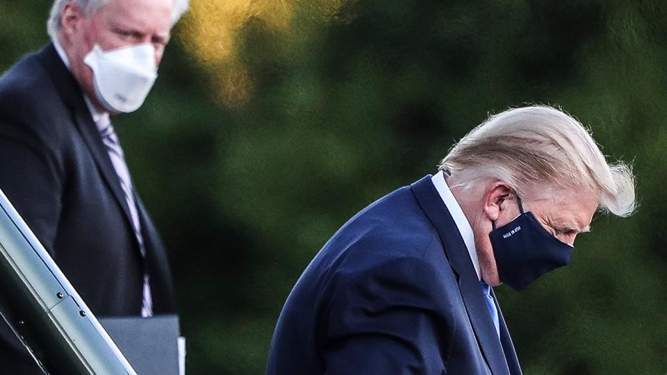 US President Donald Trump boards the presidential helicopter waiting to transport him to a military hospital, October 3, 2020.
