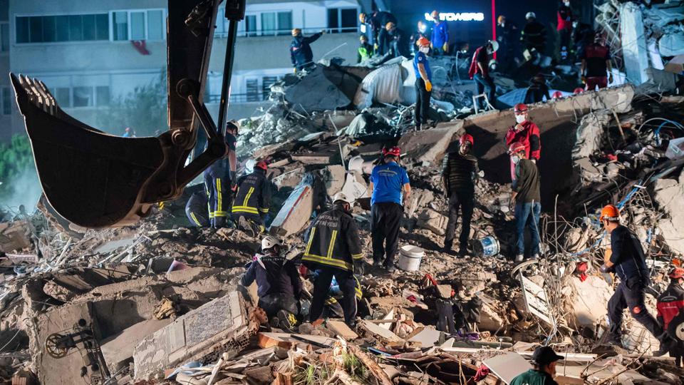 Volunteers search for survivors at a collapsed building in Izmir, Turkey, on October 31, 2020.