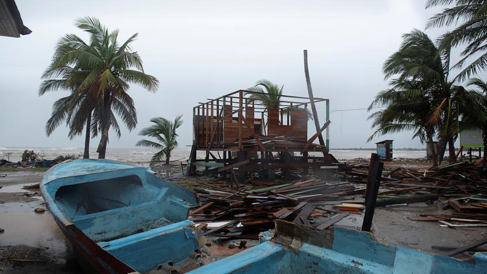 A damaged boat is seen on sand as Hurricane Iota approaches Puerto Cabezas, Nicaragua, November 16, 2020.
