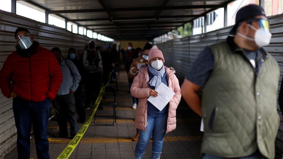 People wait to be tested for coronavirus disease (Covid-19) in Mexico City, Mexico on November 20, 2020.