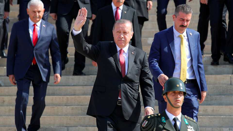 Turkish President Erdogan greets his supporters as he attends a ceremony marking the 95th anniversary of Victory Day at the mausoleum of Mustafa Kemal Ataturk in Ankara, Turkey, August 30, 2017.