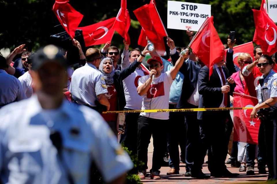 A group of pro-Erdogan demonstrators shout slogans at a group of pro-PKK protesters in Lafayette Park as Turkeys President Erdogan met with US President Donald Trump nearby at the White House in Washington, DC. May 16, 2017. 