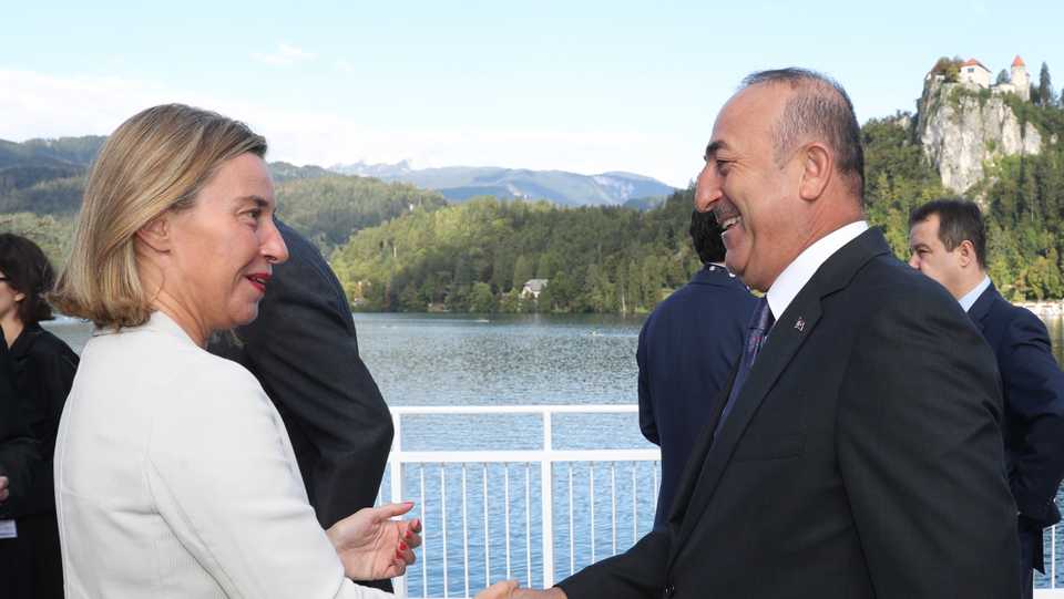 EU High Representative Federica Mogherini (L) shakes hand with Turkeys Foreign Minister Mevlut Cavusoglu at the Ministerial Meeting of the Southeast European Cooperative Initiative, in Bled, Slovenia, September 5, 2017. 