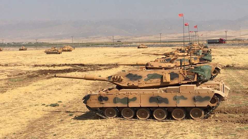 Turkish troops conduct military exercises near along its border with Iraq near the Habur Border Gate.