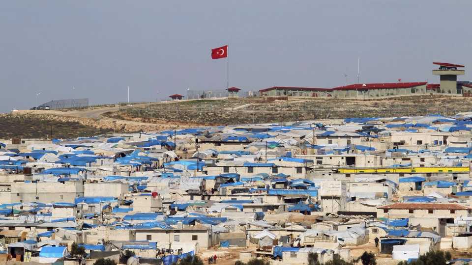 FILE PHOTO: A general view shows tents housing internally displaced people in Atma camp, near the Syrian-Turkish border in Idlib Governorate. 