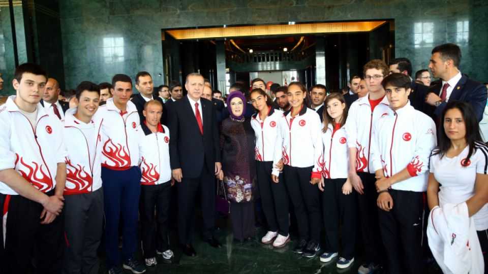 President Recep Tayyip Erdogan and his wife Emine Erdogan pose with young people and athletes from various Turkish provinces, during the celebrations of Turkey's May 19 Youth and Sports Day in Ankara, on May 19, 2016.