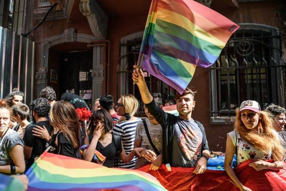 A man holds a rainbow flag during an LGBT rally in Istanbul.