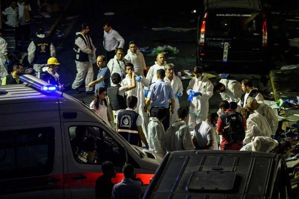 Forensic police work the explosion site at Ataturk airport on June 28, 2016