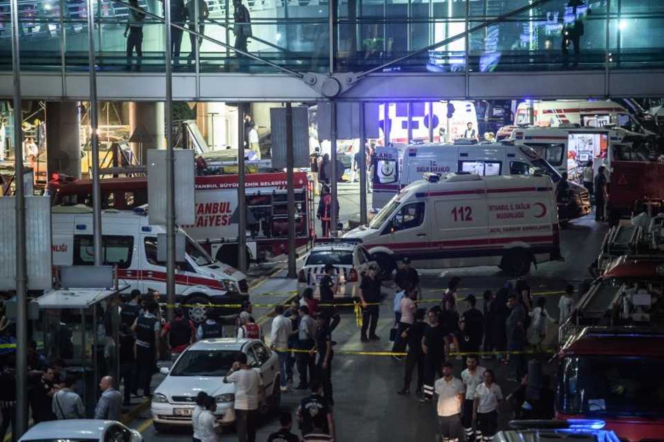 Forensic police work the explosion site at Ataturk airport on June 28, 2016.