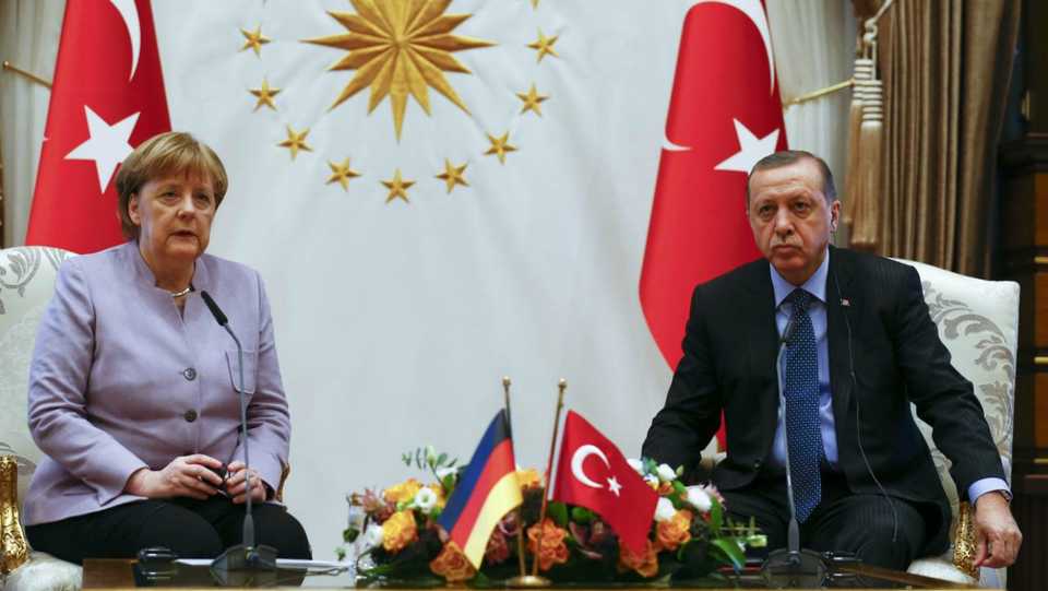 The frosty expressions of German Chancellor Angela Merkel (L) and Turkish President Recep Tayyip Erdogan at this February 2017 meeting are unlikely to have changed as the war of words between the two countries continued . (AA)