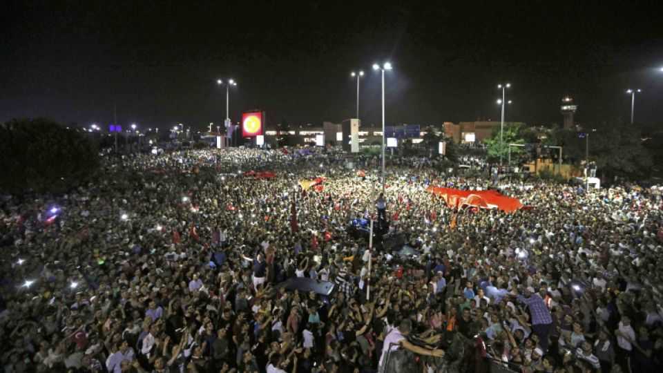 Anti-coup protesters gather outside Ataturk international airport during a tense night in Istanbul, Turkey, July 16, 2016.