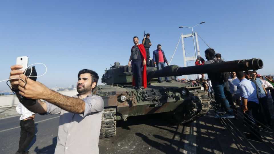 A man takes a selfie in front of a tank after troops involved in the coup surrendered on the Bosphorus Bridge in Istanbul, Turkey July 16, 2016.
