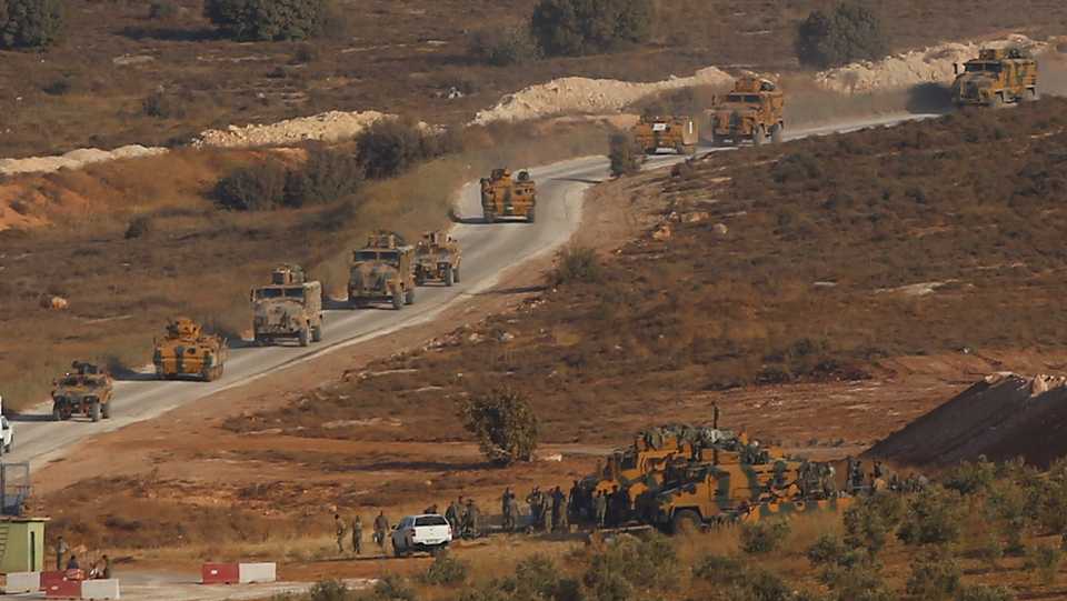 Turkish military vehicles are seen on the Turkish-Syrian border line in Reyhanli, Hatay province, Turkey, October 8, 2017. (Reuters)