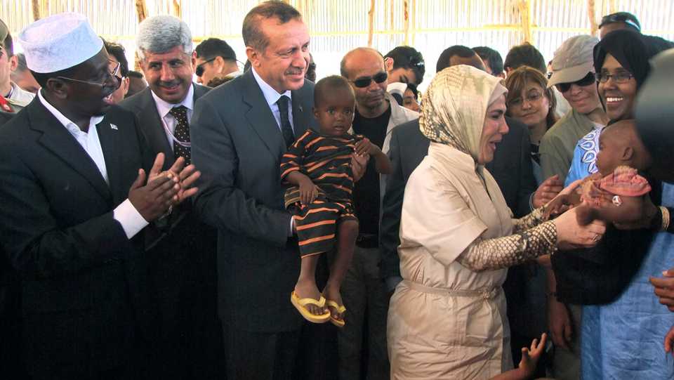 Former Somali President Sharif Sheik Ahmed (L) watches on during Turkish Prime Minister Recep Tayyip Erdogan's (CL) visit to Somalia in 2011, during the height of the country's famine bringing much needed international attention to the crisis, further cementing the relations between the two countries. File Photo (2011)