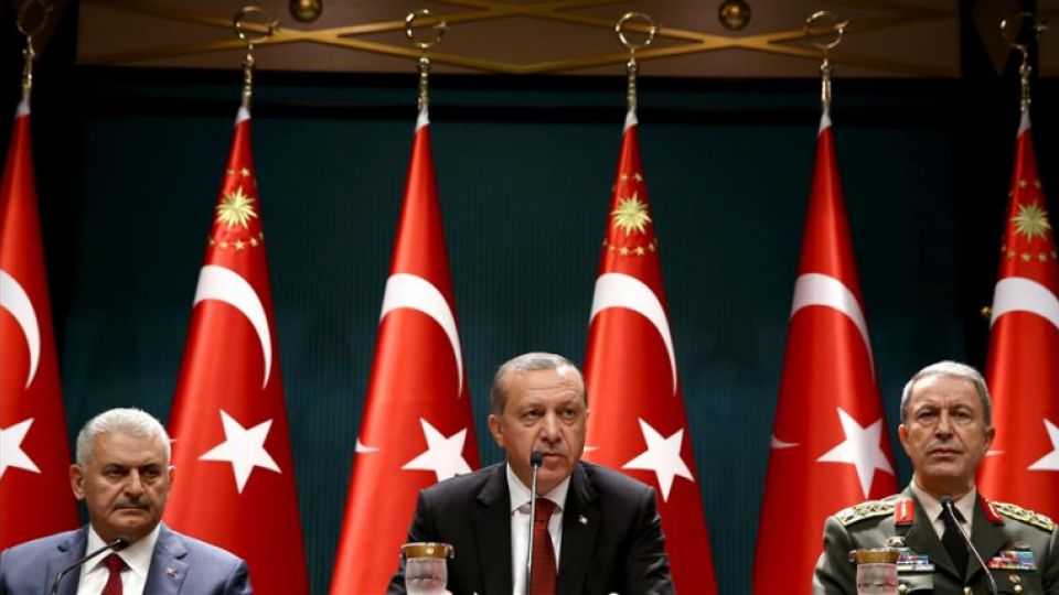 Turkish President Recep Tayyip Erdogan speaks at a press conference in Ankara alongside Prime Minister Binali Yildirim and Chief of the General Staff Hulusi Akar. 
