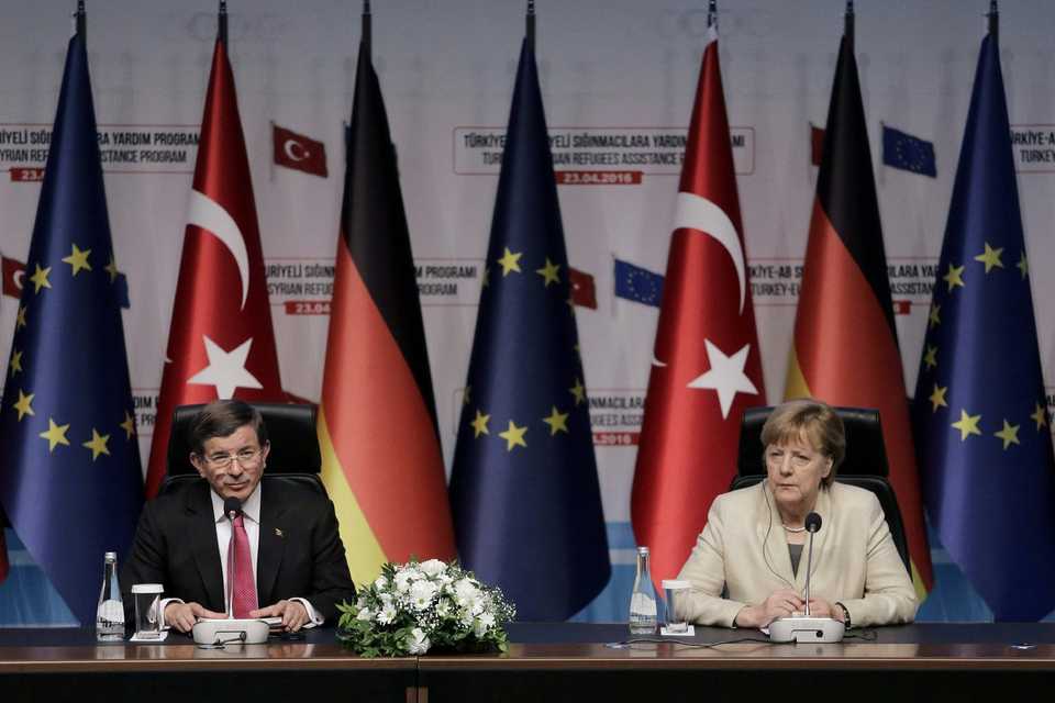 German Chancellor Angela Merkel (R) and then Turkish Prime Minister Ahmet Davutoglu (L) give a press conference after visiting the Nizip refugee camp in Gaziantep on April 23, 2016.