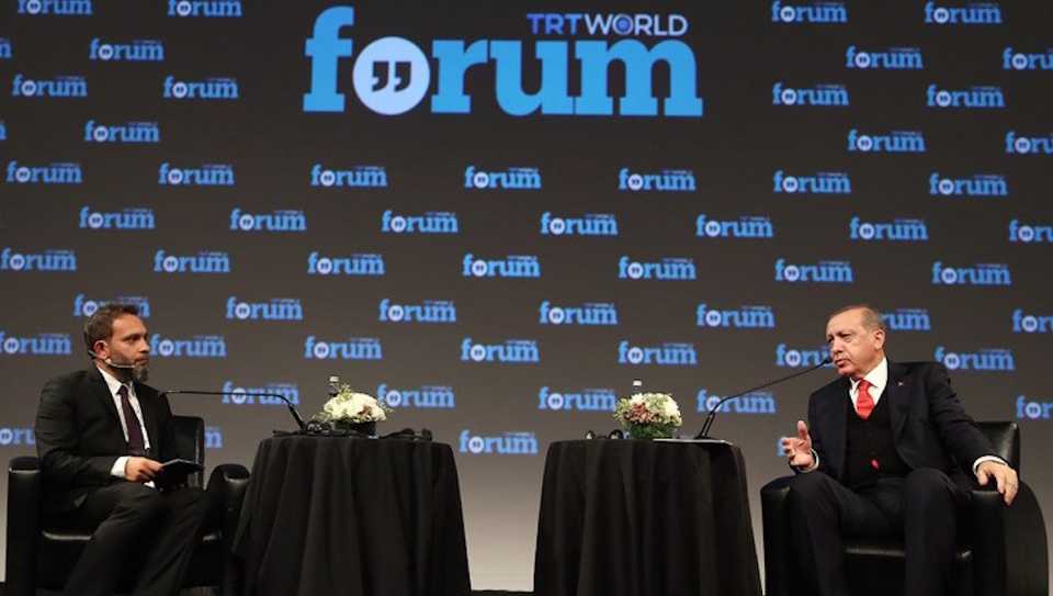 This October 19, 2017 file photo shows Turkish President Recep Tayyip Erdogan and Director of News at TRT World Fatih Er during the TRT World Forum in Istanbul.