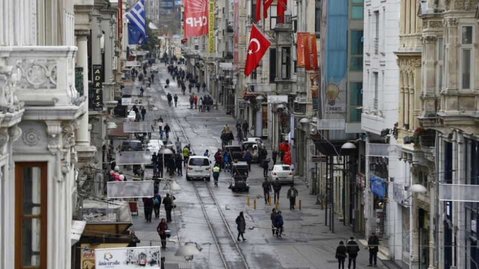 Tourists walk along Istiklal Street in Taksim, a major shopping and tourist district, in central Istanbul, Turkey.