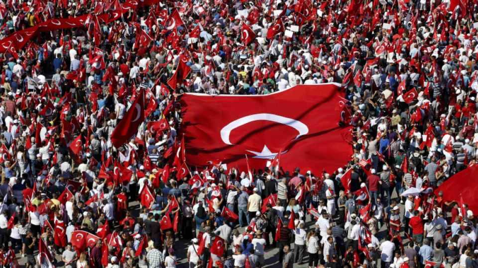 Supporters of various political parties gather in Istanbul's Taksim Square and wave Turkey's national flags before the Republic and Democracy Rally organised by main opposition Republican People's Party (CHP)