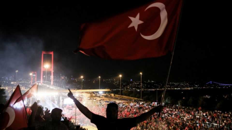 Turkish citizens rally at the Bosphorus Bridge, which will be renamed: the July 15 Martyrs' Bridge, in Istanbul to protest against the failed military coup attempt.