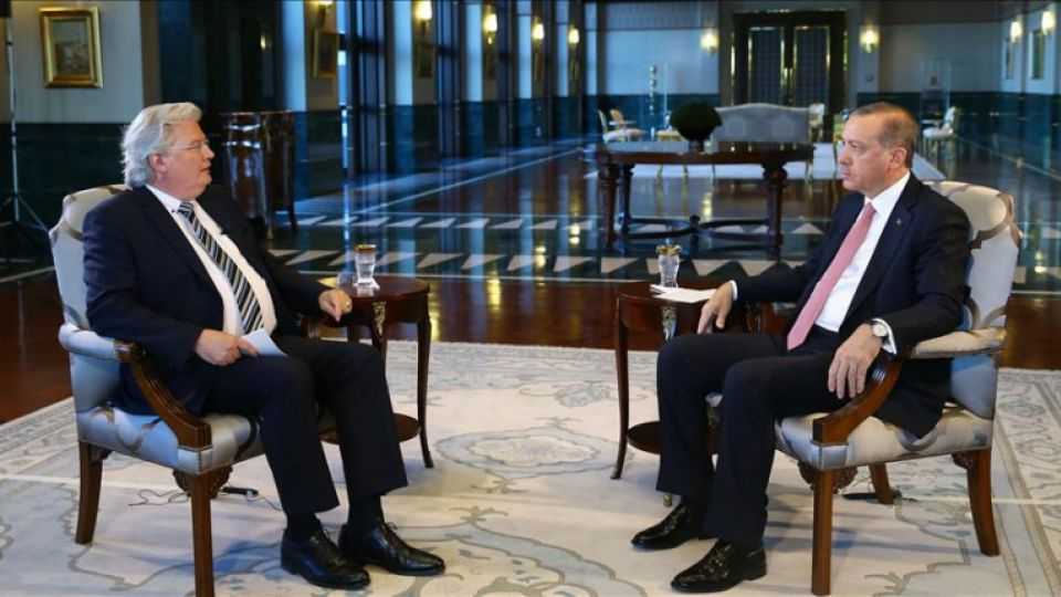 Turkish President Recep Tayyip Erdogan (R) speaks to correspondent of German TV channel ARD during an interview at Presidential Complex in Ankara, Turkey. 