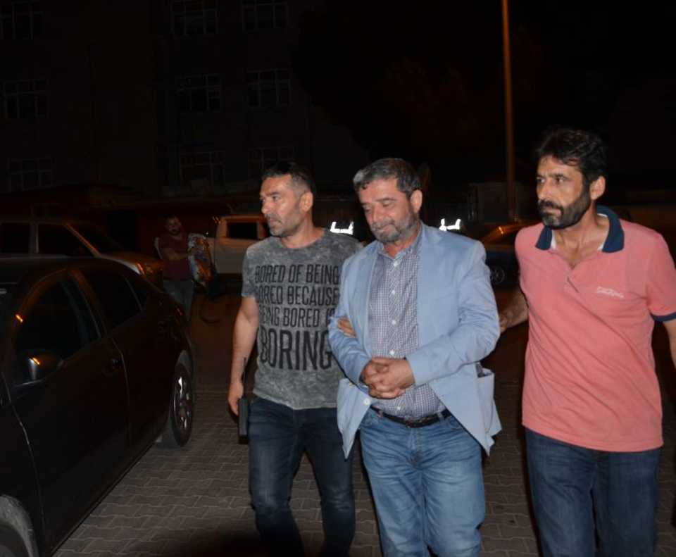 Turkish police detain Mumtazer Turkone, one of the columnists from Zaman newspaper, in Turkey's western province of Yalova, on July 27, 2016.