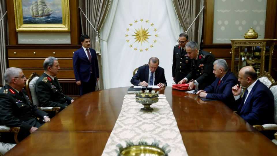 President of Turkey, Recep Tayyip Erdogan signs the decree of the Turkey's Supreme Military Council (YAS) meeting, held under Chairmanship of Turkish Prime Minister Binali Yildirim, on July 28, 2016 at Presidential Complex, in Ankara, Turkey.