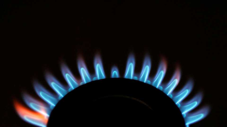 Gas flames are seen burning on a cooker.