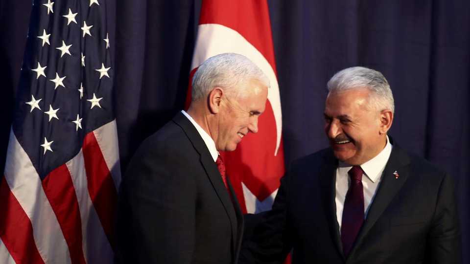 U.S. Vice President Mike Pence and Turkish Prime Minister Binali Yildirim pose for a picture before their meeting at the 53rd Munich Security Conference in Munich, Germany, February 18, 2017.