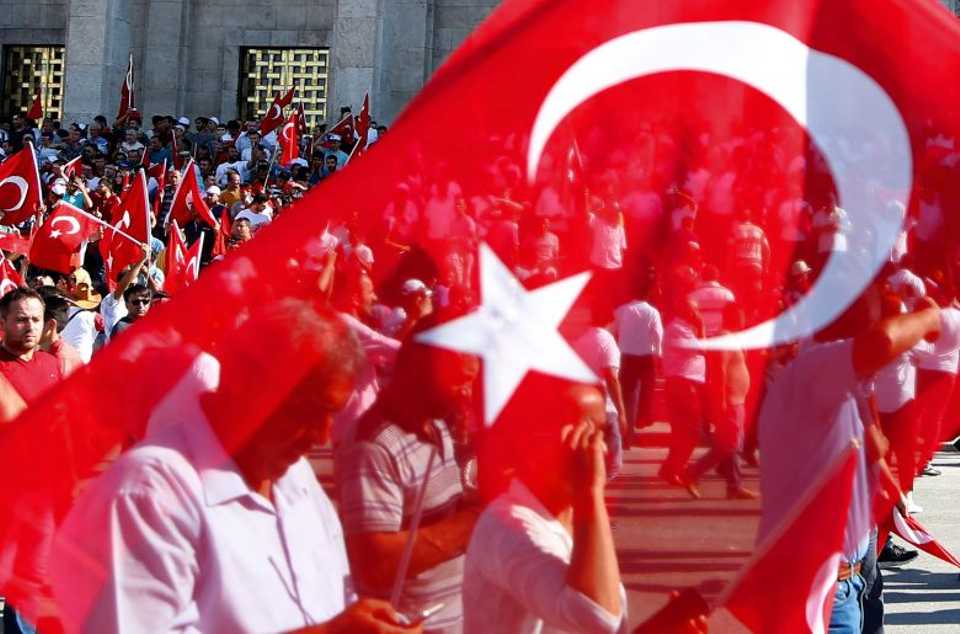 People wave Turkish national flag after failed military coup.