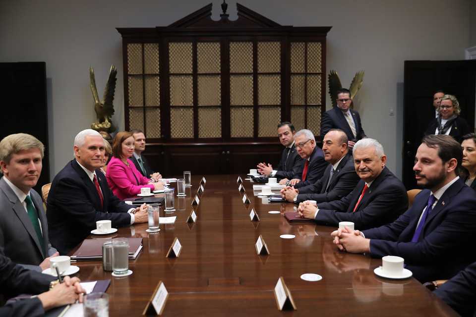 Turkish Foreign Minister Mevlut Cavusoglu (3 R), Turkish Energy and Natural Resources Minister Berat Albayrak (R), Turkish Ambassador to the United States Serdar Kilic (4 R) and Binali Yildirim’s foreign affairs adviser Kerim Uras also attended the meeting with Mike Pence (2L). (Photo AA)