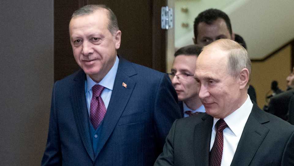Russian President Vladimir Putin (R) welcomes Turkish President Recep Tayyip Erdogan (L) as they enter a hall during their meeting in the Bocharov Ruchei residence in the Black Sea resort of Sochi, Russia, Monday, November 13, 2017.