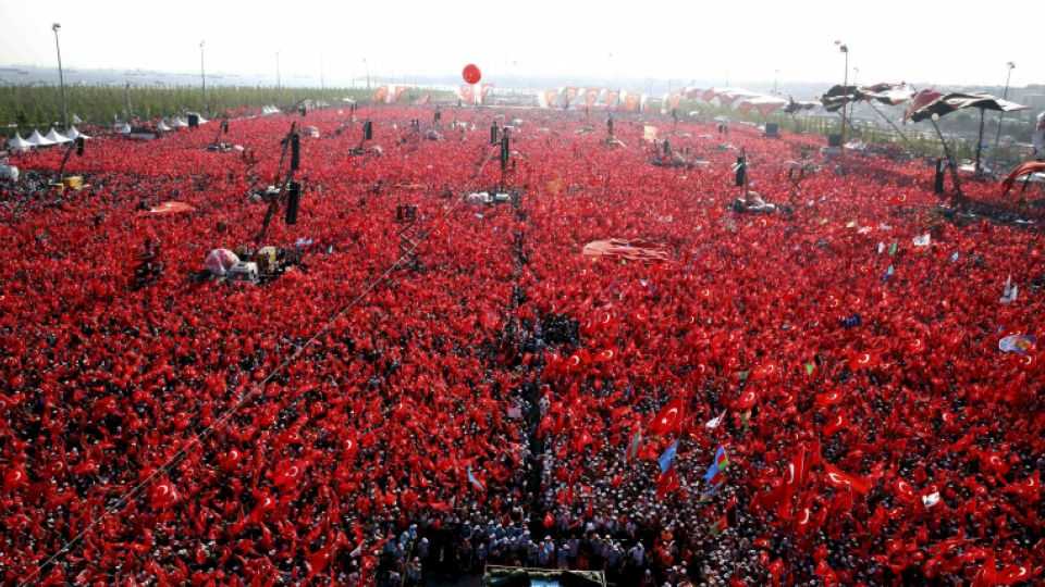People wave Turkish flags during the Democracy and Martyrs Rally in Istanbul.