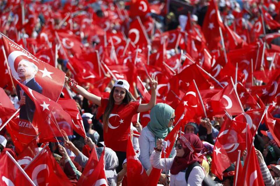 People wave Turkish flags during the Democracy and Martyrs' Rally in Istanbul, Turkey, August 7, 2016. 
