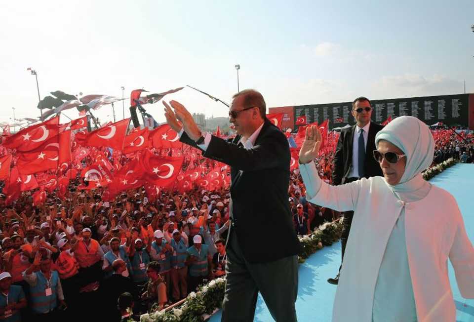 This picture released by Turkey's Presidential Press Service on August 7, 2016 at Yenikapi district of Istanbul shows Turkish President Recep Tayyip Erdogan (L) and his wife Emine Erdogan (R) at the pro-democracy rally in Yenikapi.