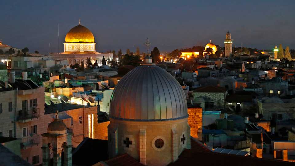 The old city of Jerusalem, with the Dome of the Rock (L) in the Al Aqsa Compund.