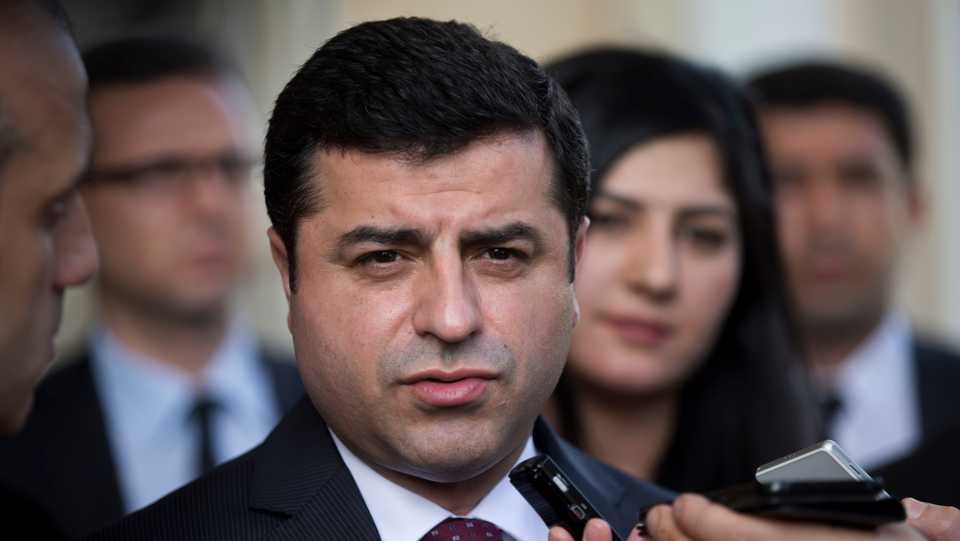 In this Monday, February 15, 2016 file photo, Turkish co-chairman of People's Democratic Party, or HDP, Selahattin Demirtas speaks with journalists in Athens.
