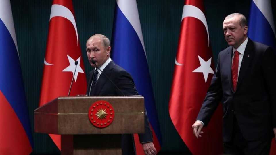 Turkish President Tayyip Erdogan and Russian President Vladimir Putin arrive for a press conference in Ankara, Turkey, September 28, 2017.