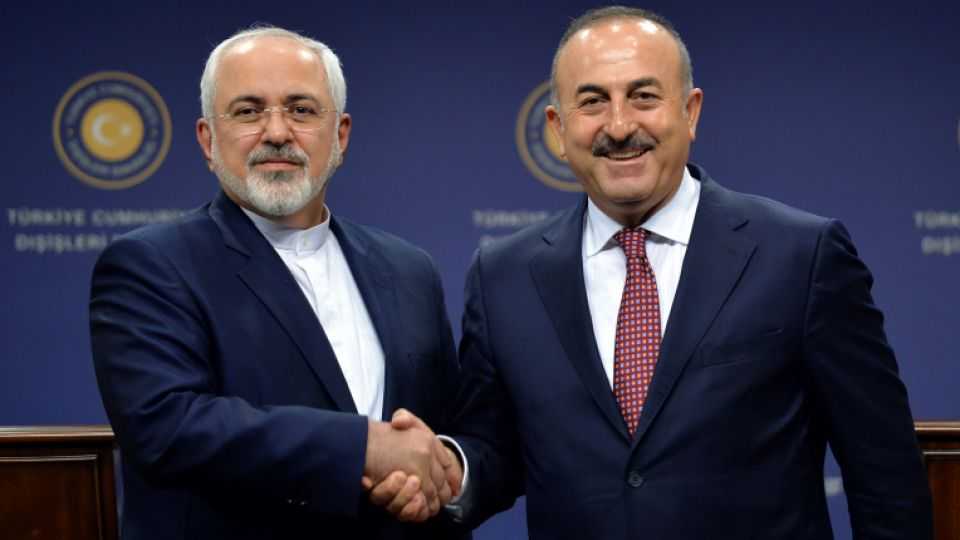 Turkish Foreign Minister Mevlüt Çavuşoğlu shakes hands with his Iranian counterpart Mohammad Javad Zarif after a news conference in Ankara, Turkey, August 12, 2016.