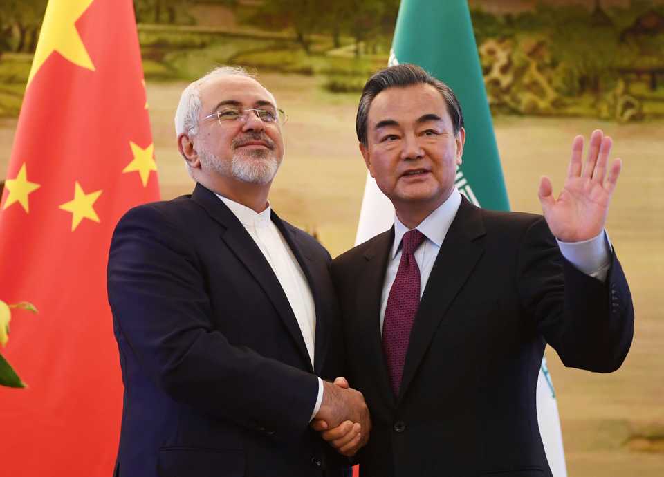 Iranian Foreign Minister Mohammad Javad Zarif meets his Chinese Foreign Minister Wang Yi in December 2016. The two countries didn’t let US sanctions cut off their trade ties.