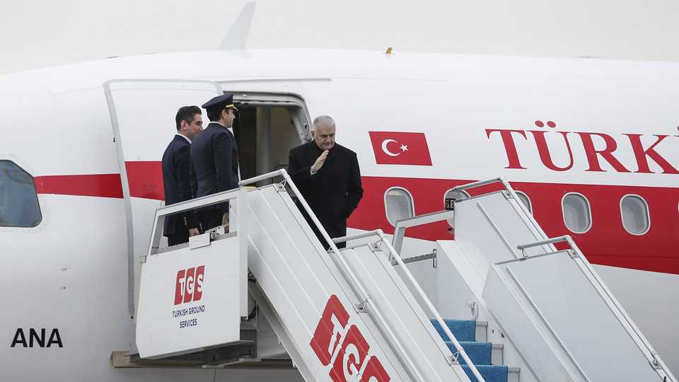 Turkey's Prime Minister Binali Yildirim boards the plane as he departs from the capital Ankara for Dhaka, Bangladesh, for an official visit, December 18, 2017.