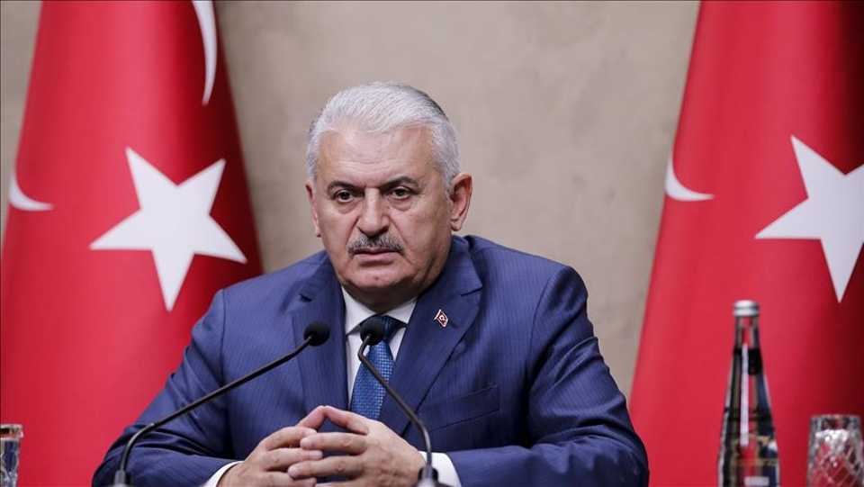 Turkish Prime Minister Binali Yildirim holds a press conference at Ankara Esenboga Airport ahead of his departure to Bangladesh's capital Dhaka for an official visit on December 18, 2017 in Ankara, Turkey.