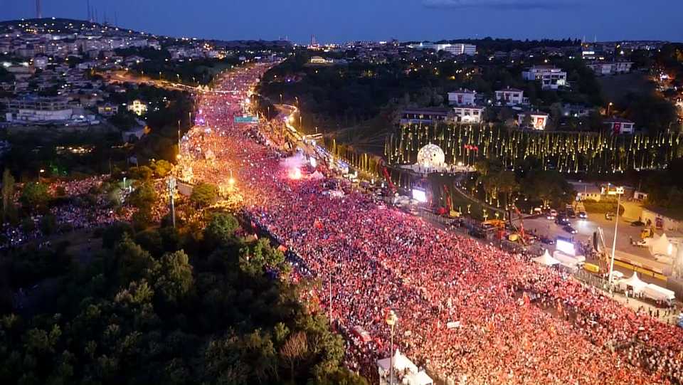 Turkish people march at the July 15 Martyrs Bridge on the first anniversary of the defeated coup that saw 250 people killed and more than 2,000 injured on July 15-16, 2016.